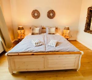 A bed or beds in a room at Mountain Suites Braunlage
