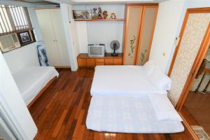 Postel nebo postele na pokoji v ubytování Shan Shui B&B