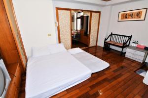 Postel nebo postele na pokoji v ubytování Shan Shui B&B