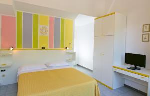Tempat tidur dalam kamar di Residence Castiglione
