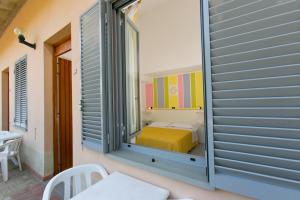 Postel nebo postele na pokoji v ubytování Residence Castiglione