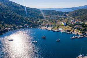an aerial view of a harbor with boats in the water at Notia Luxury Living in Porto Koufo