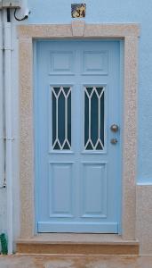 a blue door on the side of a building at Velha 34 in Albufeira
