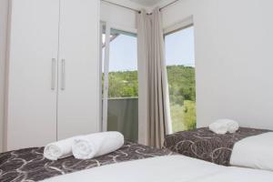 Postel nebo postele na pokoji v ubytování Holiday house Villa Bleu