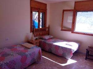 Un pat sau paturi într-o cameră la villa Garibaldi