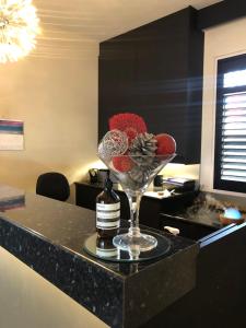 a wine glass sitting on top of a counter at Abbotsleigh Motor Inn in Armidale