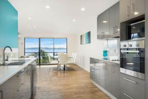 A kitchen or kitchenette at Self Contained Beach View Apartment