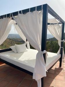 Łóżko lub łóżka w pokoju w obiekcie Casa Ladera