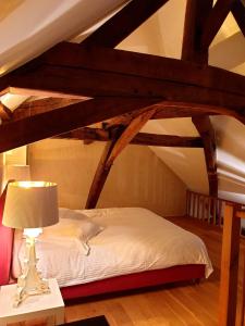 Rúm í herbergi á Restauberge Peitry