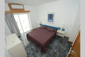 A bed or beds in a room at Edificio Gaviota apartamento 3