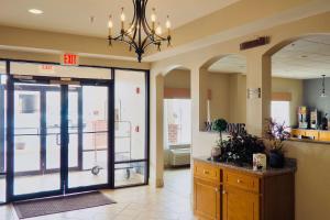 a lobby with a exit sign on the door at Econo Lodge in Augusta