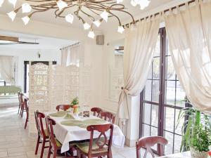 a dining room with a table and chairs at Oberża Złota Gęś in Siewierz +34 photos