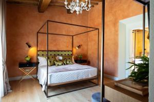 Voodi või voodid majutusasutuse Borgo I Vicelli Adults Only Relais toas