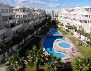 an overhead view of a swimming pool in front of buildings at Sea view Penthouse Denia, ELEGANCE in Denia