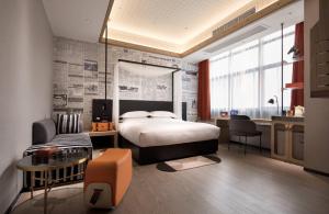 Postel nebo postele na pokoji v ubytování Arthur Hotel Zhujiang New Town Guangzhou-Pazhou Exhibition Center Branch + 37 fotografií