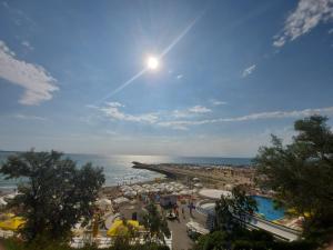 a view of the beach and the ocean from a resort at Didy Residence in Eforie Nord
