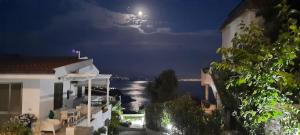 a view of the ocean at night from a house at Villa Anna Maria in Capo Vaticano