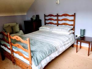Un pat sau paturi într-o cameră la Moybrone Flat