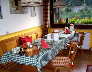 a table with red napkins on top of it at Landhaus Schwaben in Schönmünzach
