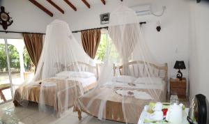 Postel nebo postele na pokoji v ubytování Villa Veuve Casadani Hotel