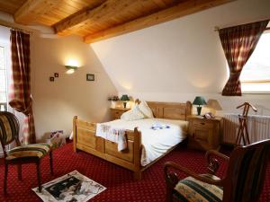 En eller flere senge i et værelse på Maison d'hôtes La Cerisaie