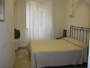 Postel nebo postele na pokoji v ubytování Albergo Cannon d'Oro