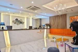 a lobby of a hotel with a reception desk at Central Park Hotel Busan in Busan