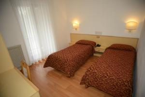 Postel nebo postele na pokoji v ubytování Hotel Canada