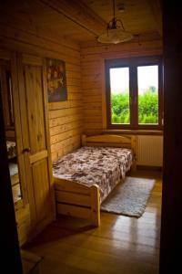 Apartamenty Pod Gruszką tesisinde bir odada yatak veya yataklar