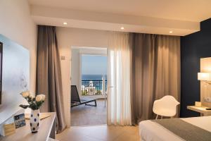 a hotel room with a view of the ocean at Royal Palm Resort & Spa - Adults Only in Playa Jandia