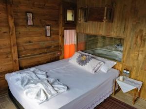 Postel nebo postele na pokoji v ubytování Gödence Hotel Restoran Bungalow