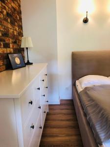 Postel nebo postele na pokoji v ubytování Studio Polanica