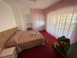 Voodi või voodid majutusasutuse Park Hotel Bozzi toas