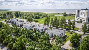 an aerial view of a building with trees and the water at Pärnu Ranna Residents in Pärnu