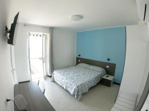 Postel nebo postele na pokoji v ubytování Hotel Aurora