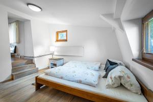 Posteľ alebo postele v izbe v ubytovaní Apartmány Chata Jedlová hora