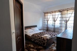 Postel nebo postele na pokoji v ubytování CASA ALEXANDRA + 17 fotografií