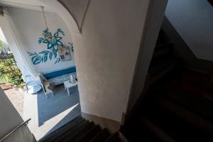 a stairway with a blue and white wall at Villa Serioli in Marone