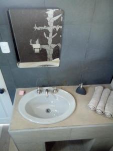 a bathroom with a sink and a mirror at EkoClub in Paine +49 photos