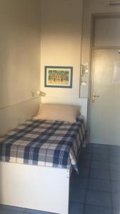 Postel nebo postele na pokoji v ubytování Hotel Spiaggia