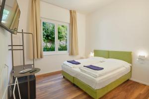Voodi või voodid majutusasutuse Hotel Paradiso Conca d'Oro toas