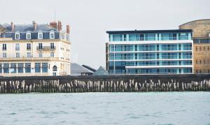 a group of buildings next to a body of water at Oceania Saint Malo in Saint Malo