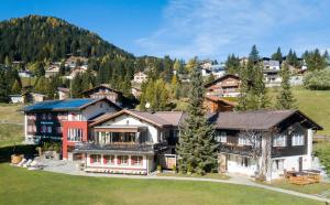 an aerial view of a house in the mountains at Erlebacherhus in Lenzerheide