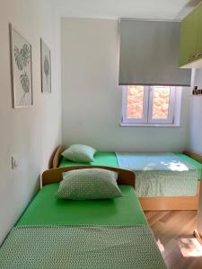 Кровать или кровати в номере City apartments Bobic