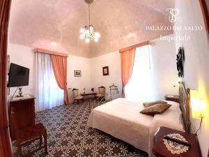 Postel nebo postele na pokoji v ubytování Palazzo del SalTo