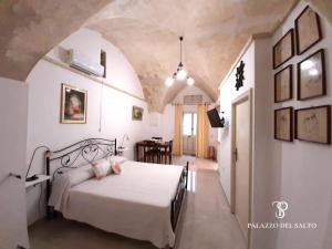 Postel nebo postele na pokoji v ubytování Palazzo del SalTo