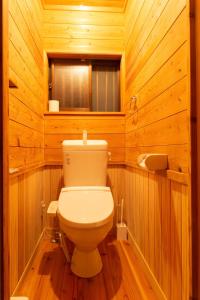 a bathroom with a toilet in a wooden room at Kumage-gun - House - Vacation STAY 89468 in Yudomari