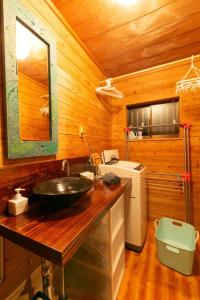 a bathroom with a sink in a wooden cabin at Kumage-gun - House - Vacation STAY 89468 in Yudomari