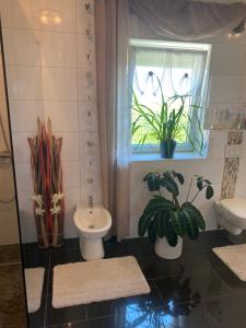 Koupelna v ubytování Luxus FeWo - Spannagl + 7 fotografií