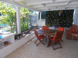 a dining room with a table and chairs at Silence of the Birds in Olhão